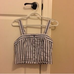 striped top and green anorak